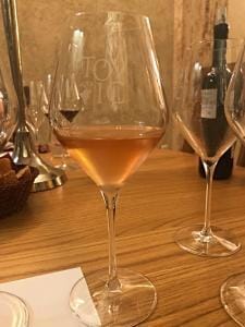 Glass of Tomić rosé.